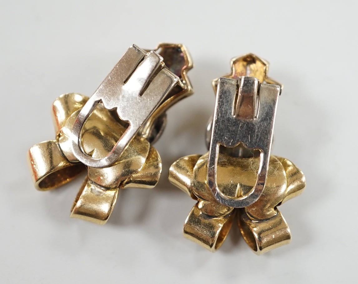 A pair of mid 20th century yellow and white metal, diamond cluster set scroll ear clips, 27mm, gross weight 13.5 grams.